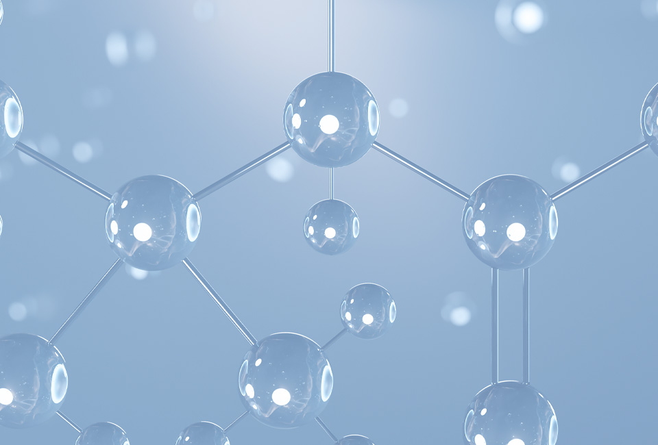 3D render of a clear, glossy molecular structure model on a blue backdrop.